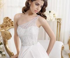 Preziosi ricami in perle dell'abito da sposa dell'Atelier Il Sogno della Sposa Lei&Lui