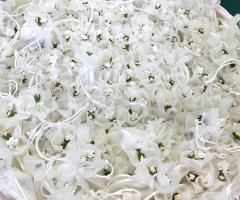 Sacchettini porta confetti in tulle con fiorellino di carta
