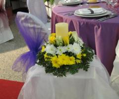 Vivaio Ferrante - Candela e fiori per il matrimonio come centrotavola