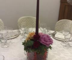 Centrotavola con candela per il ricevimento di matrimonio