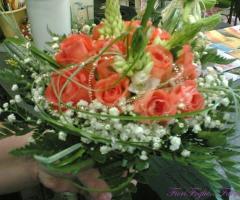 Bouquet da sposa con rose arancioni