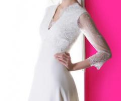 Abito da sposa con maniche lunghe ricamate