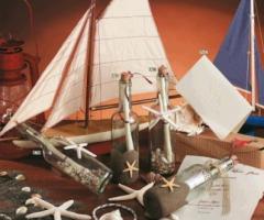 Bottiglia messaggio con conchiglie e stella marina