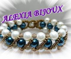 Bracciale importante perle bianche e perle color petrolio  impreziosito da cristalli