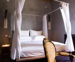 Camera da letto dell'Hotel Caol Ishka a Siracusa