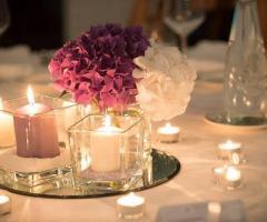 Fiori d'Arancio Fioristi - Centrotavola con candele e ortensie