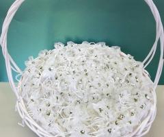 Sacchettini porta confetti in tulle con fiorellino di carta